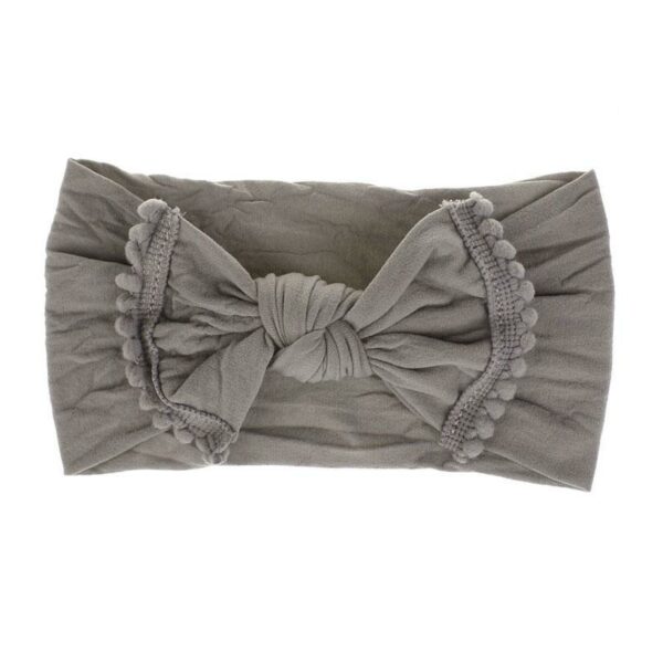 Bandeau Bébé Fille Nolwenn Le Bandeau Français | Bandeau Cheveux Femme <p>Notre bandeau bébé Nolwenn est caractérisé par un élégant effet noué et des pompons charmants. Disponible en plusieurs coloris, il s'adapte parfaitement à tous les styles.</p>